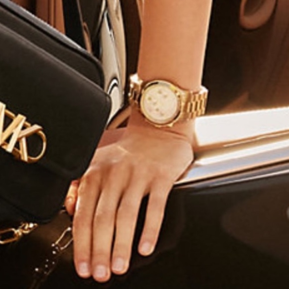Michael Kors gold tone runway watch